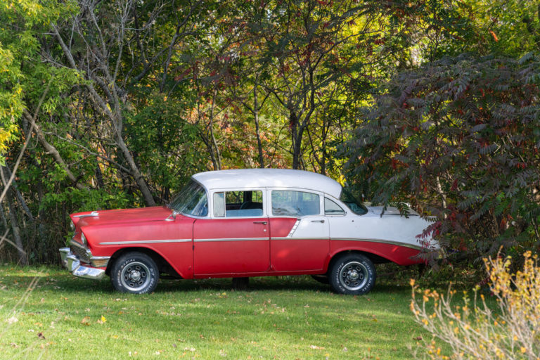 Vintage Red and White Car in Nature