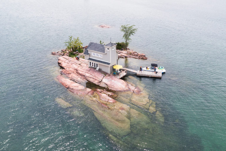 Tiny Island with Cottage and Boat