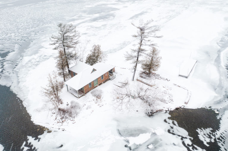 Cottage on Small Snow Covered Island
