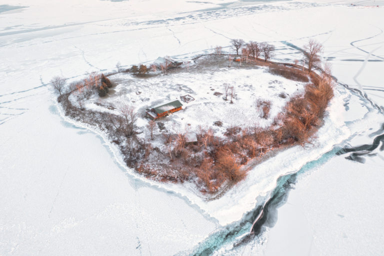 Island with Cottage Surrounded by Ice 02