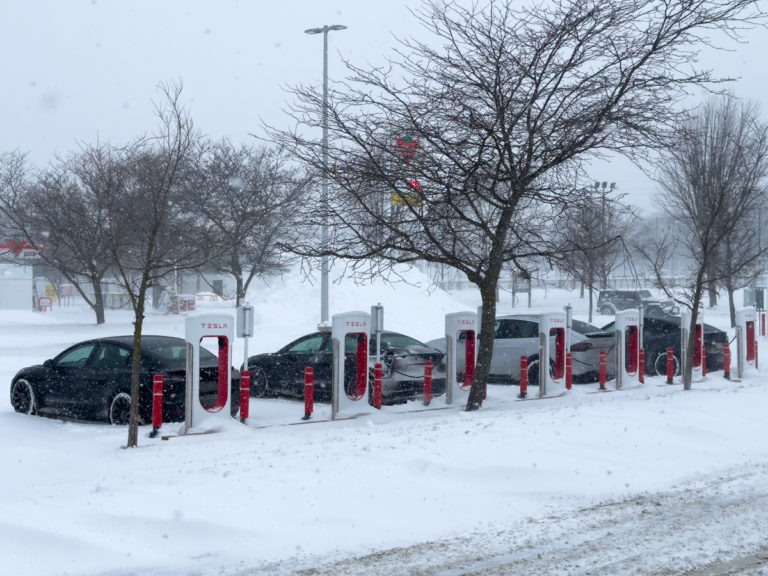 Tesla Charging in Cold Weather: Snowy EV Station Scene