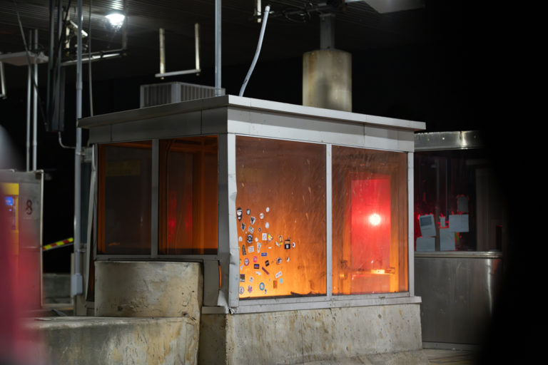Abandoned Toll Booth with Glow at Night