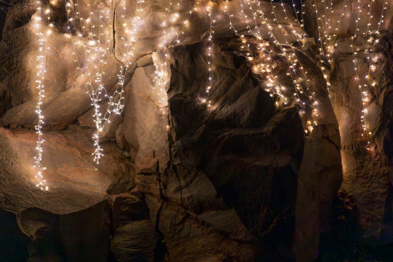 Twinkling Fairy Lights on Weathered Rock Face
