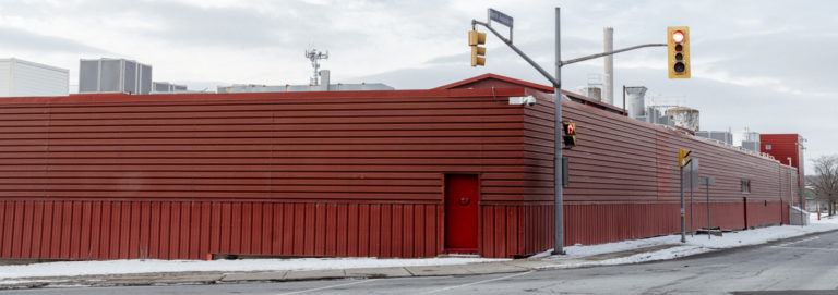 Red Industrial Building with Urban Surroundings