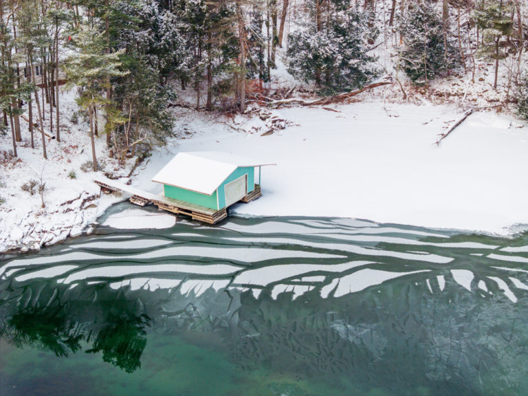 Snowy St Lawrence Boathouse on Frozen River