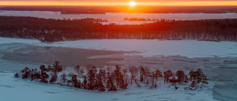 Golden Sunrise Over Frozen Winter Vista