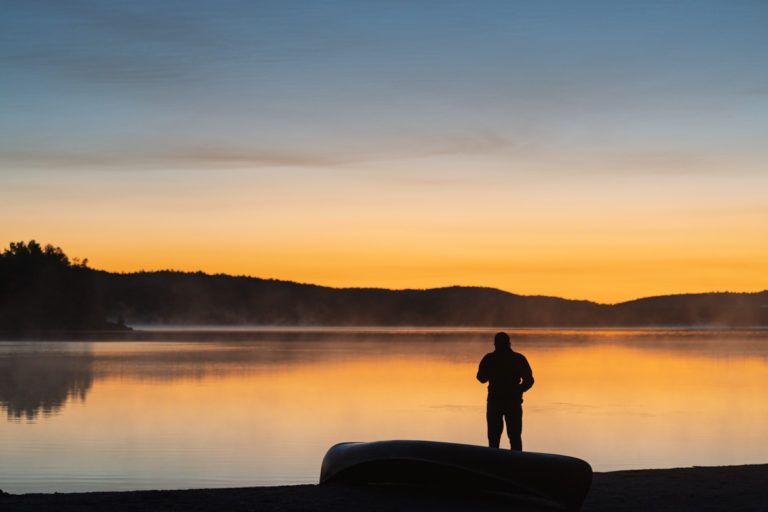 Preparing to Launch a Canoe at Sunrise in Algonquin Park