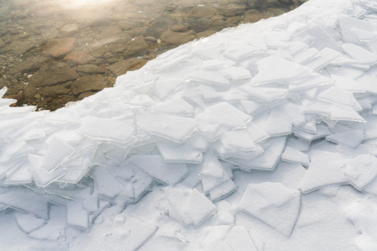 Fractured Ice Sheets on a Winter Shore