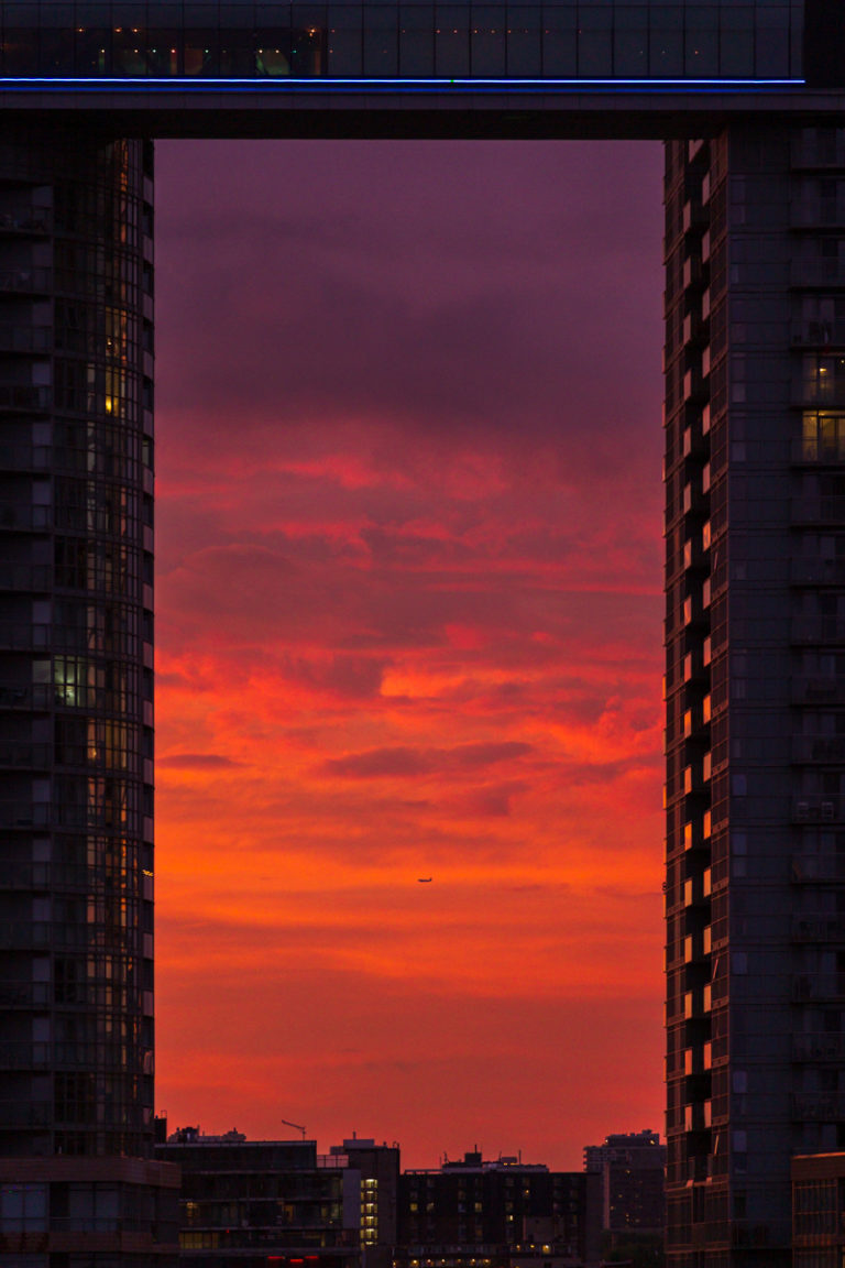 Framed by Towers, Lit by Fire