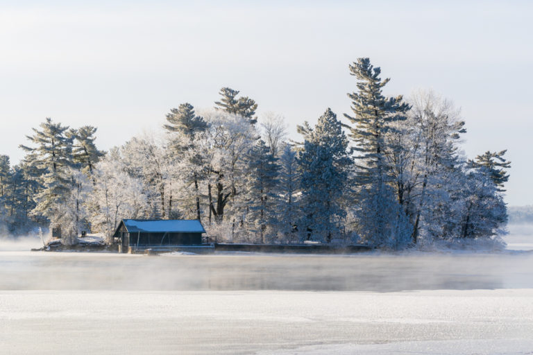Frost-Covered Island Cabin on a Still Winter Morning