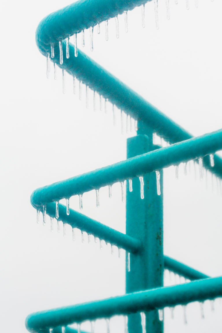 Icicles on Teal Railings After Freezing Rain