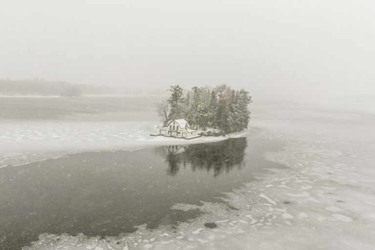 Snow-Covered Boathouse on a Winter Island