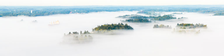 Ship Navigating Through Morning Fog in the Thousand Islands