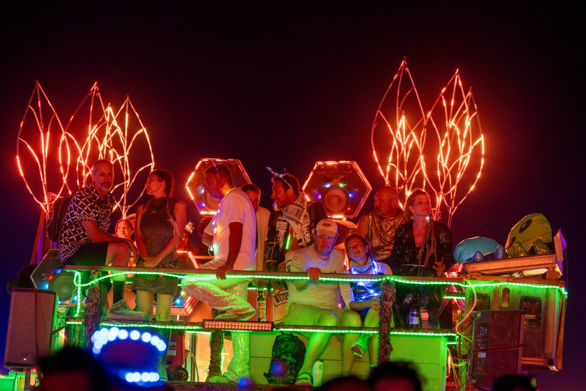Participants Watch the Man Burn on Various Mutant Vehicles