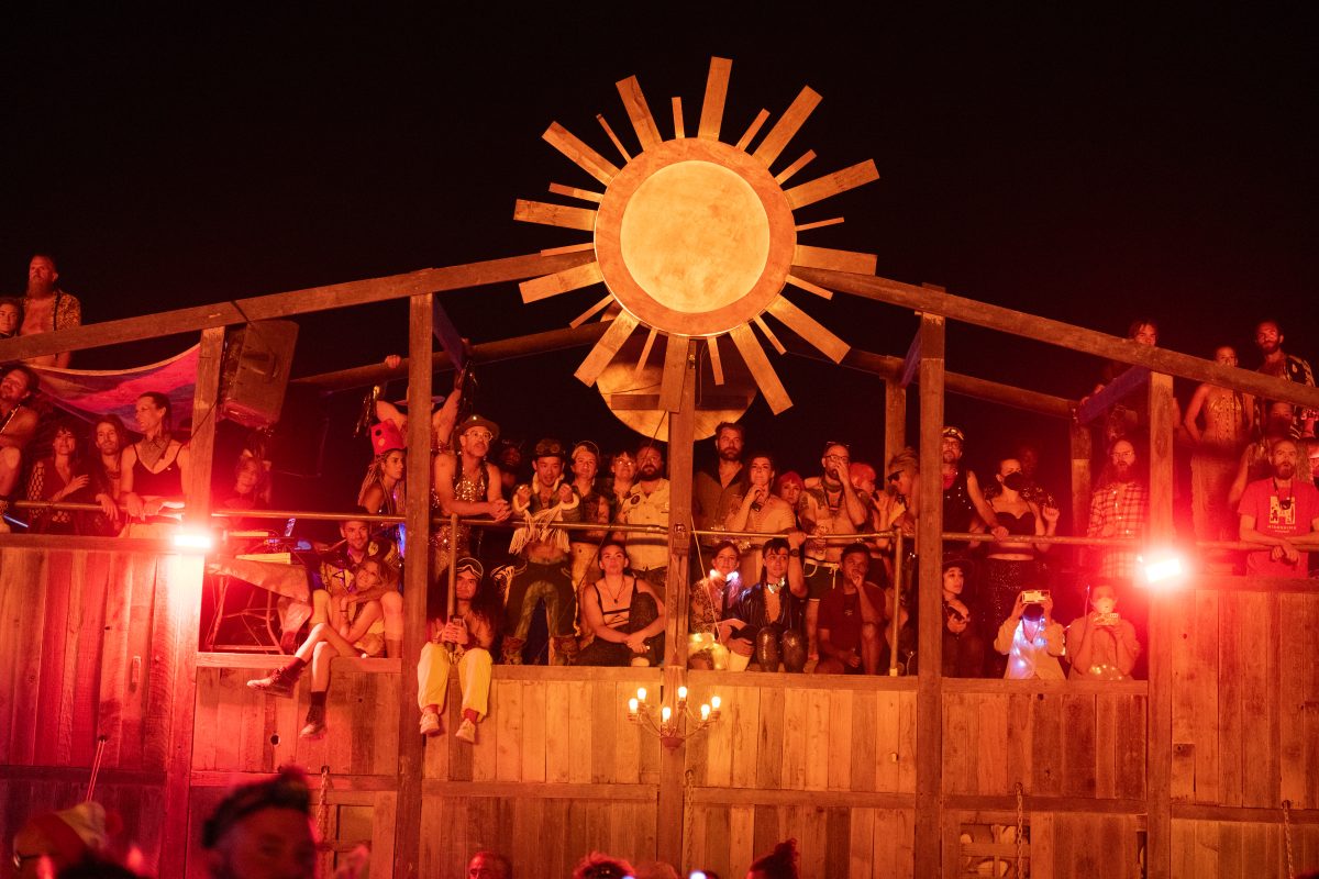 Participants Watch the Man Burn on Various Mutant Vehicles