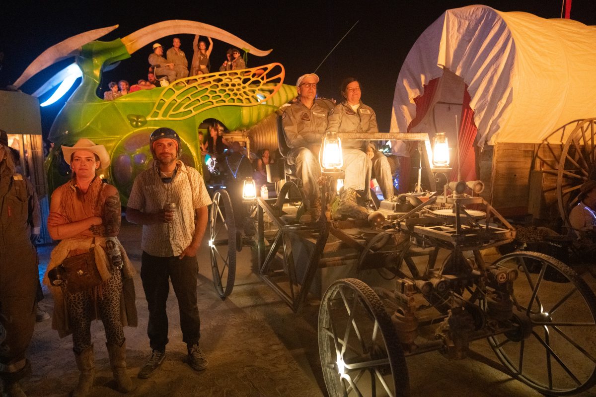Participants Watch the Man Burn on Various Mutant Vehicles