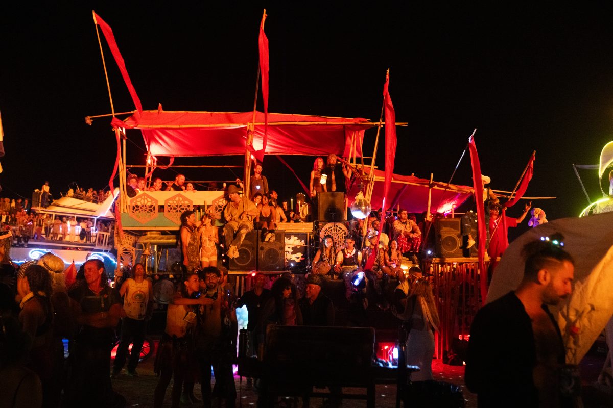 Participants Watch the Man Burn on Various Mutant Vehicles