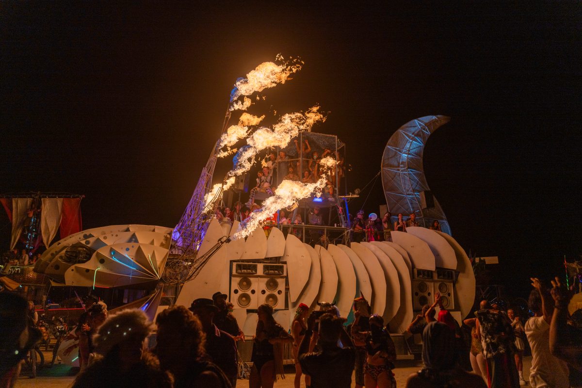 Participants Watch the Man Burn on Various Mutant Vehicles