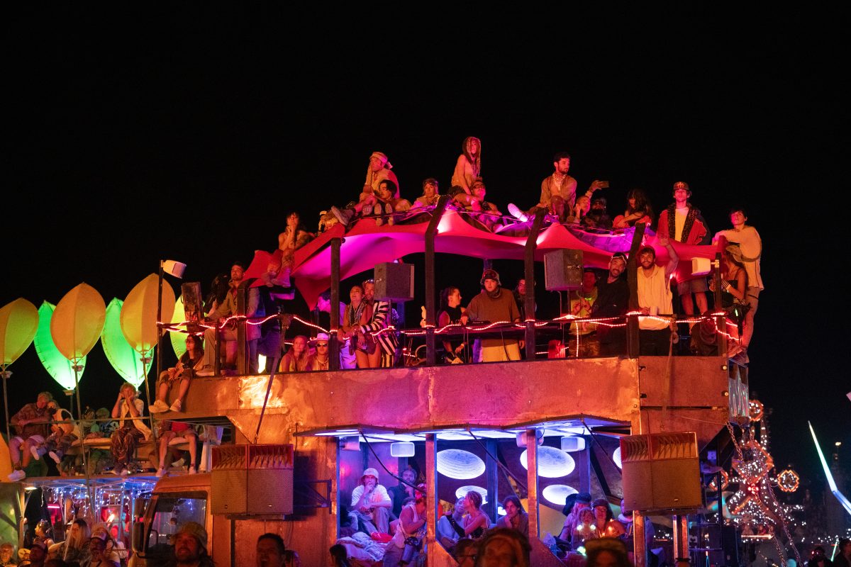 Participants Watch the Man Burn on Various Mutant Vehicles