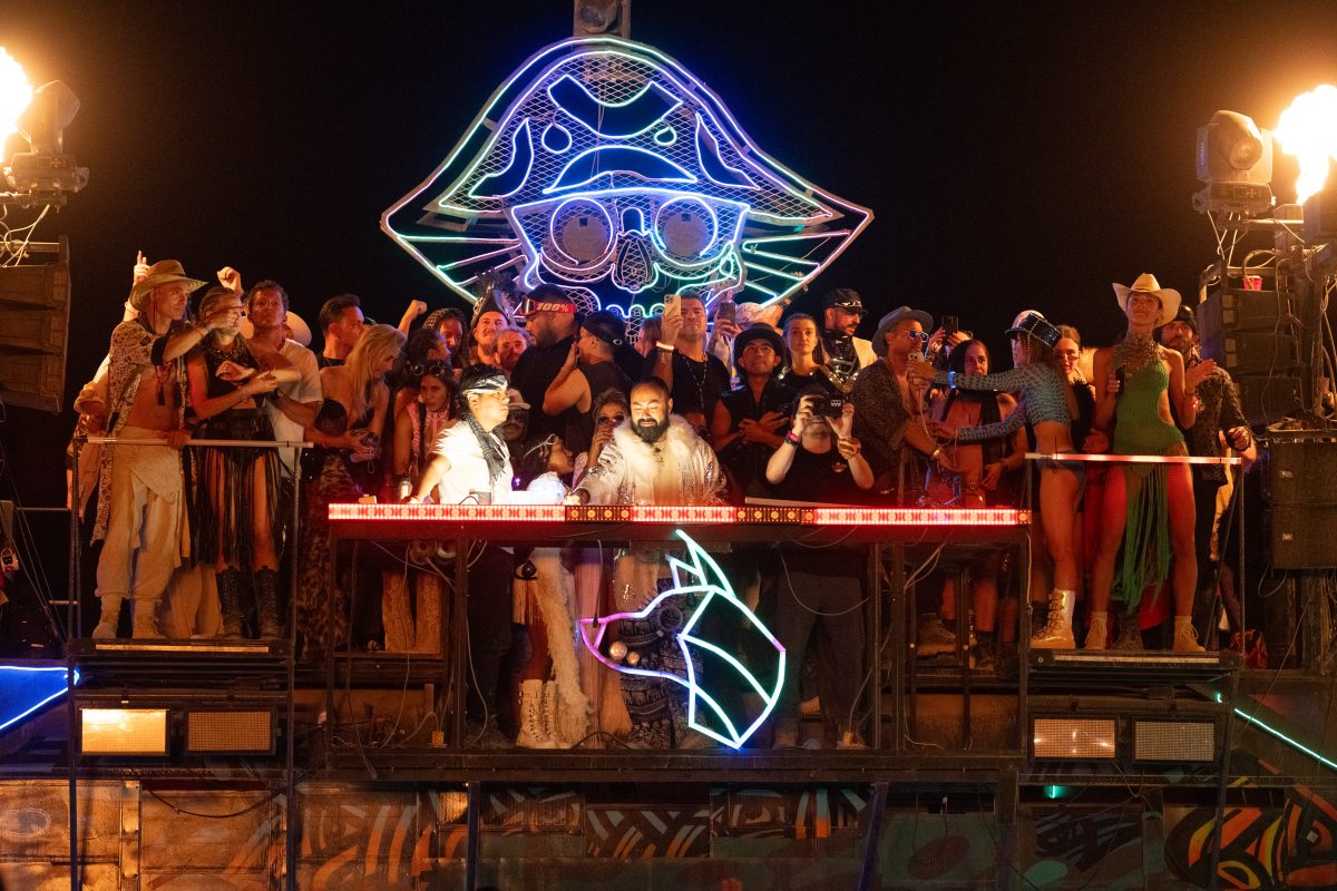 Participants Watch the Man Burn on Various Mutant Vehicles