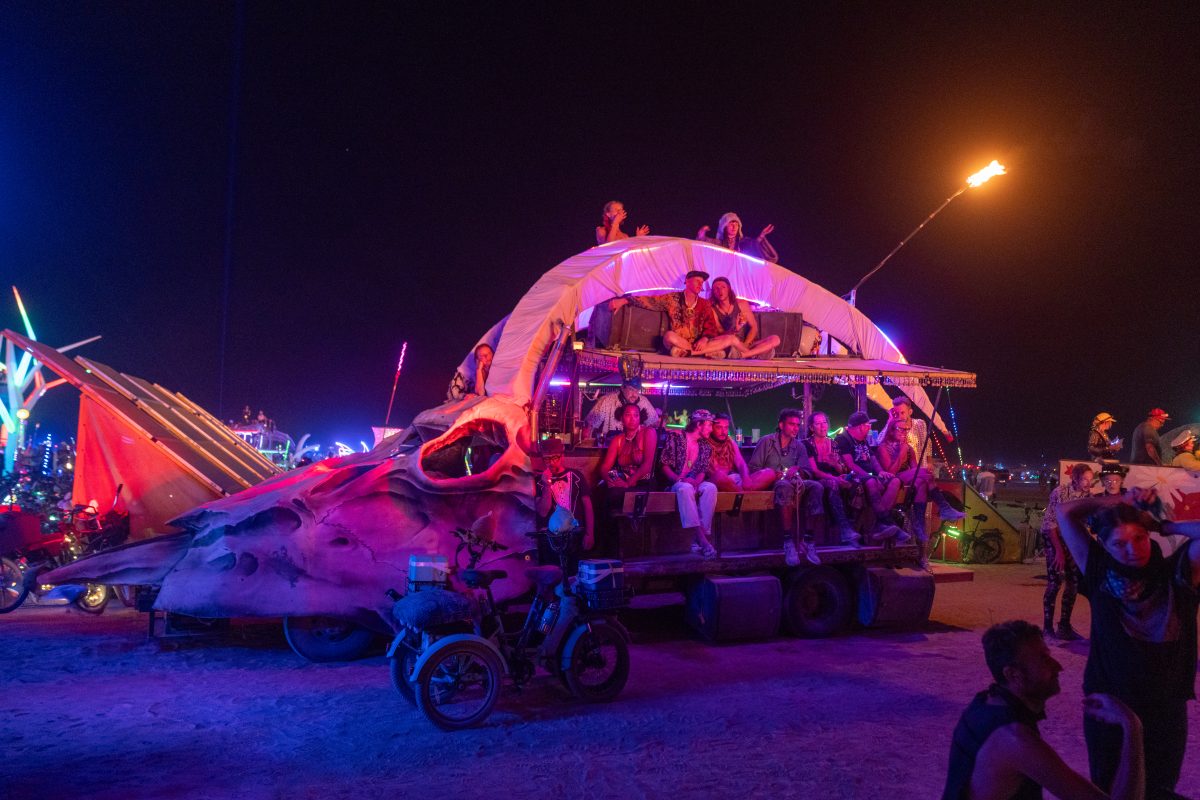 Participants Watch the Man Burn on Various Mutant Vehicles