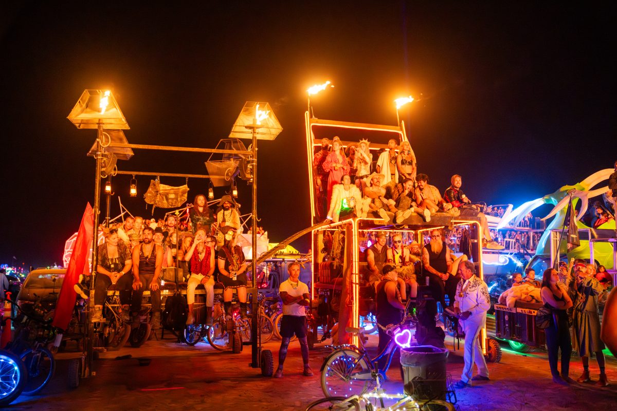 Participants Watch the Man Burn on Various Mutant Vehicles