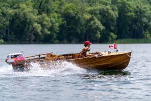 Vintage Wooden Boat Cruising Thousand Islands Ontario Canada with Dog and Flags