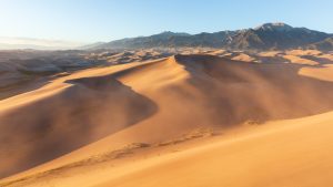 Sculpted Dunes and Distant Peaks