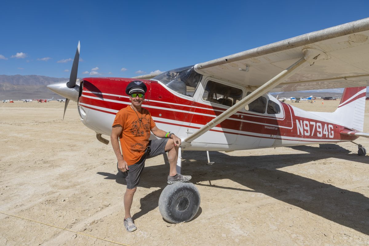 Pilot and Cessna 180 at the Airport