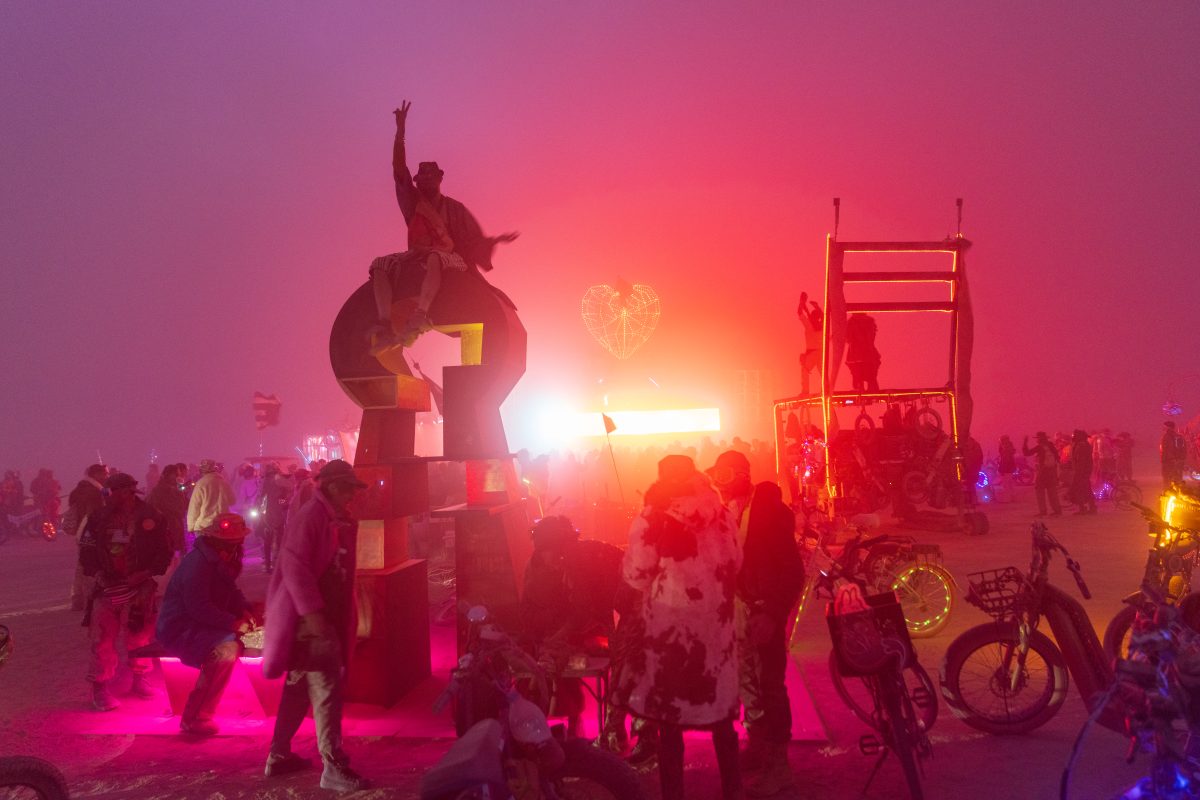 The Artist Atop Keyhole to Other Dimensions by John H Dill III and Team