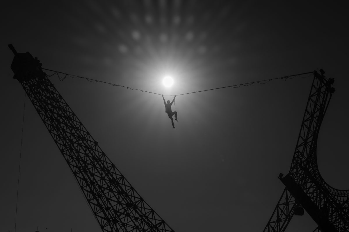 Hanging from the Cable at EIFFELA BROKEN DREAM by Philippe Maindron